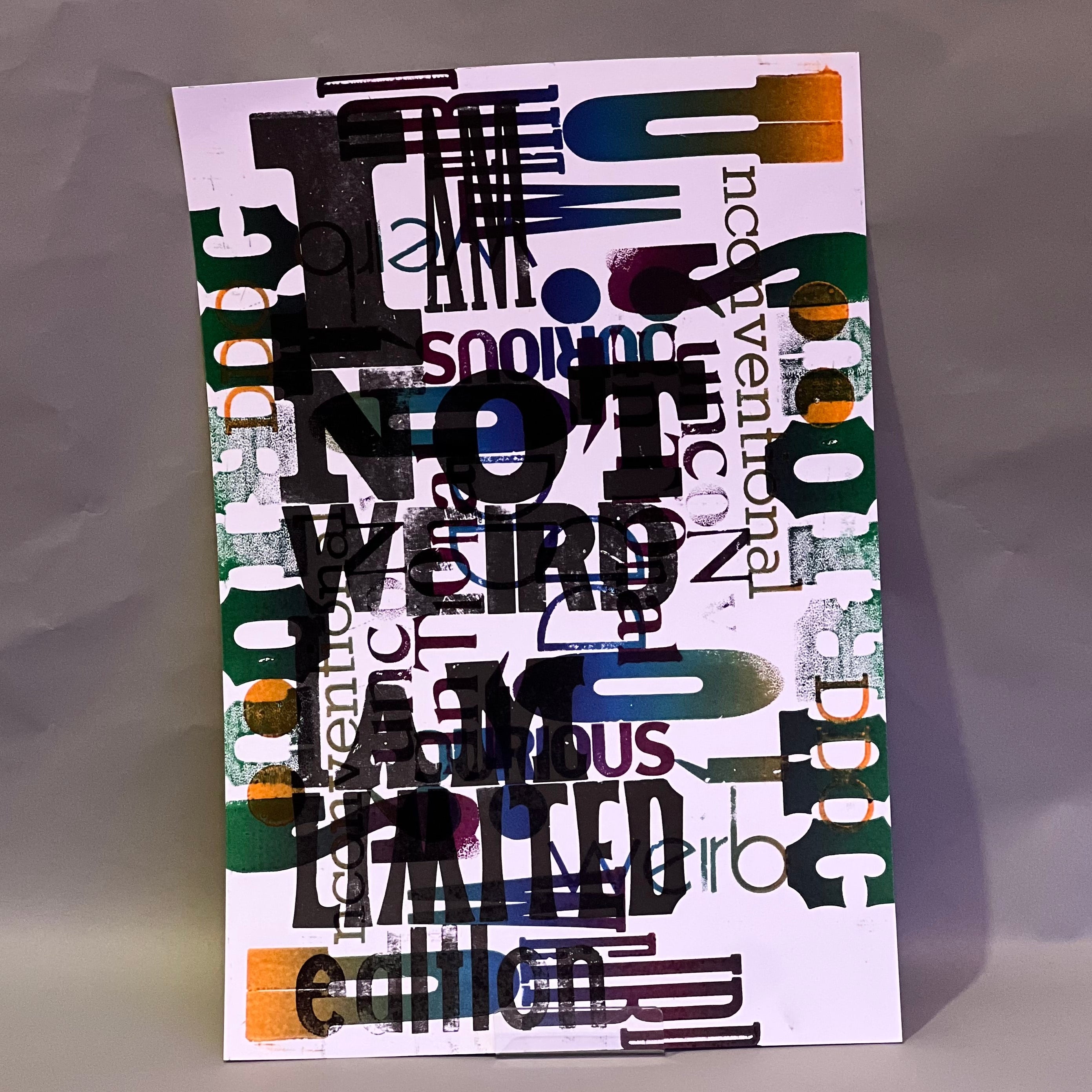 Colorful poster with text 'I AM NOT WEIRD I AM LIMITED edition' on a textured surface, printed on letterpress.