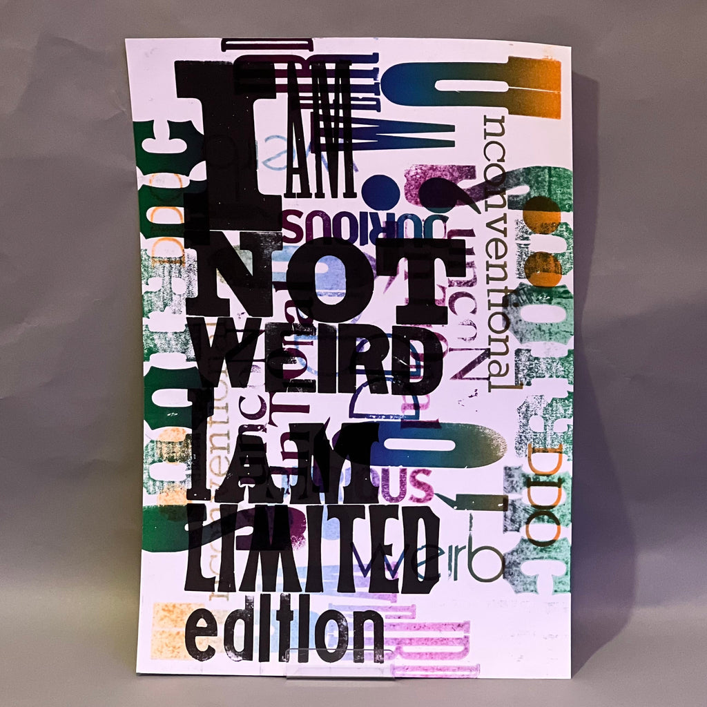 Colorful poster with text 'I AM NOT WEIRD I AM LIMITED edition' on a textured surface, printed on letterpress.