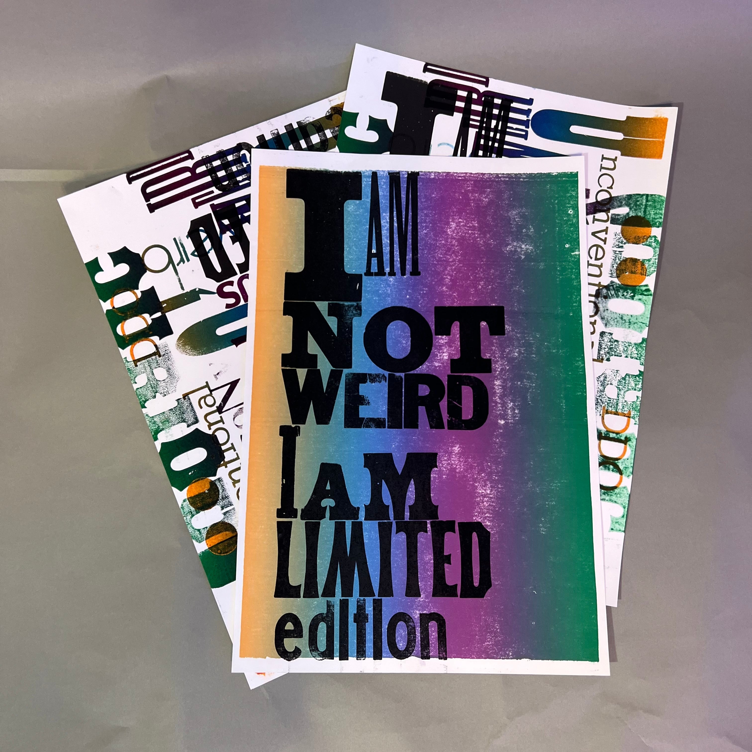 Colorful poster with text 'I AM NOT WEIRD I AM LIMITED edition' on a textured surface, printed on letterpress.