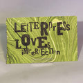 Letterpress Loves Imperfection on green marble paper