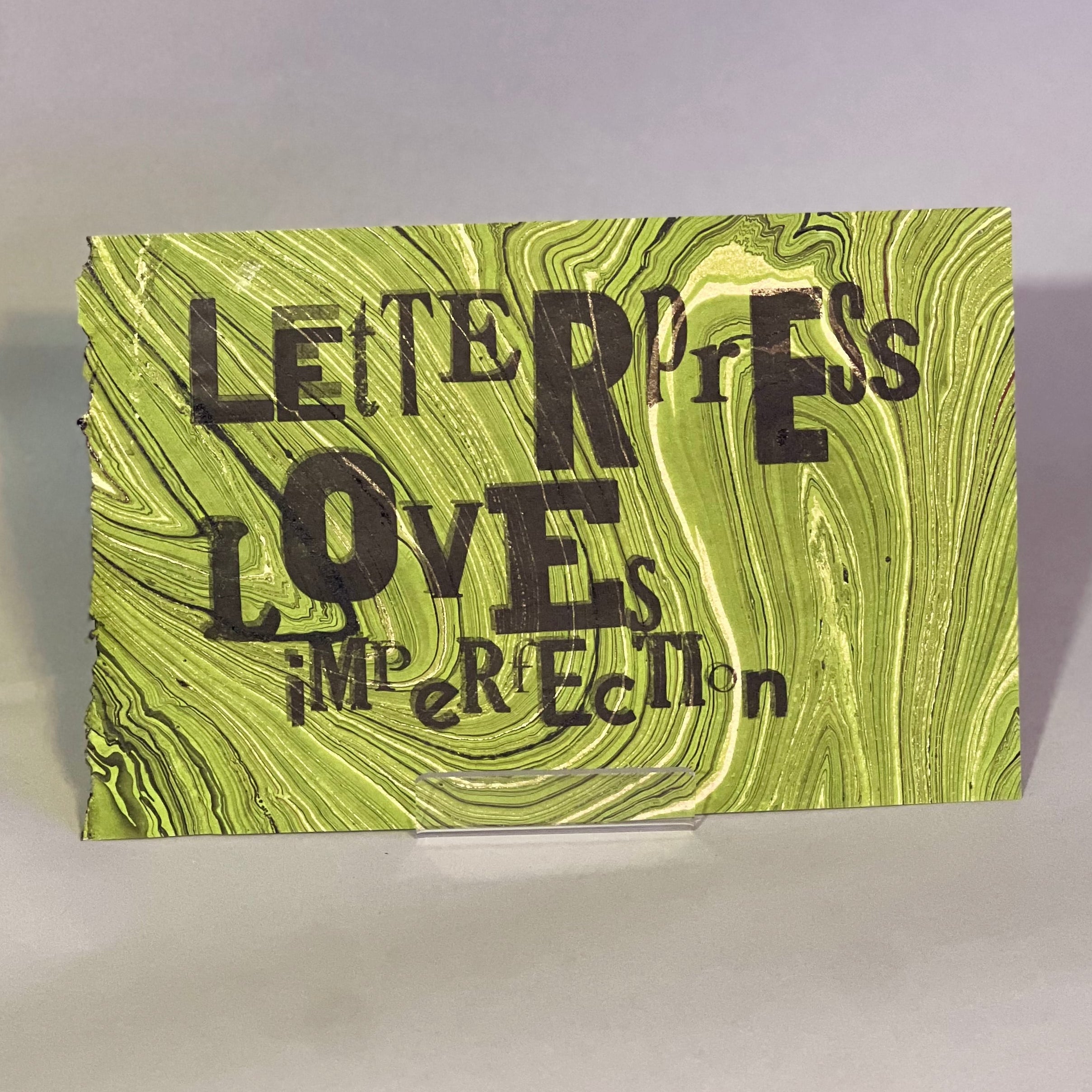 Letterpress Loves Imperfection on green marble paper